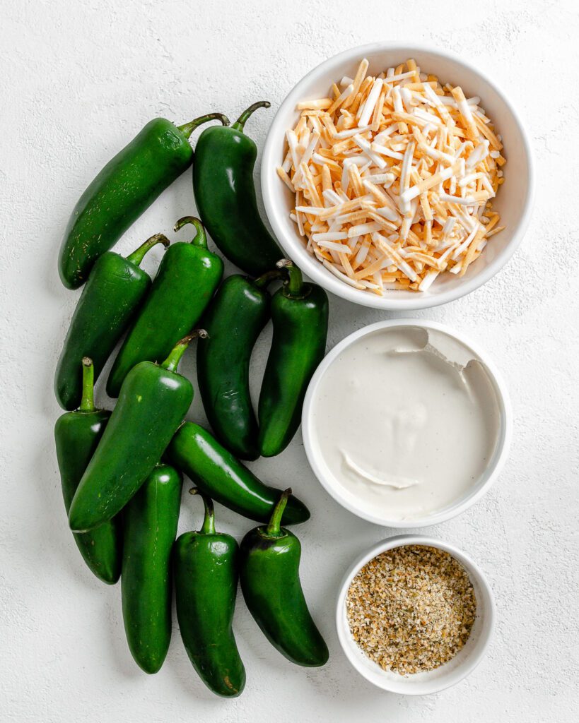 ingredients for Easy Vegan Jalapeno Poppers spread out against a white surface