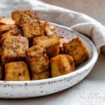 completed Air Fryer Tofu plated against a light surface