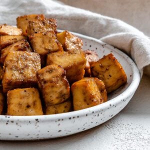 completed Air Fryer Tofu plated against a light surface