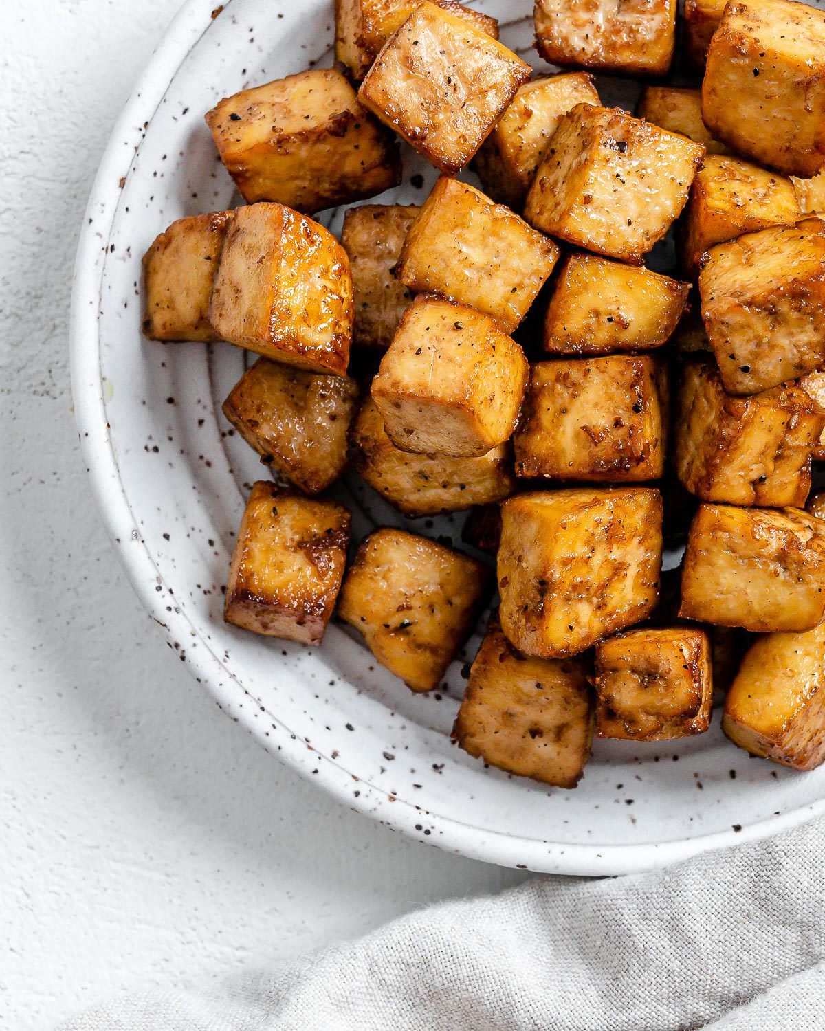 Completed Air Fryer Tofu plated against a light surface.