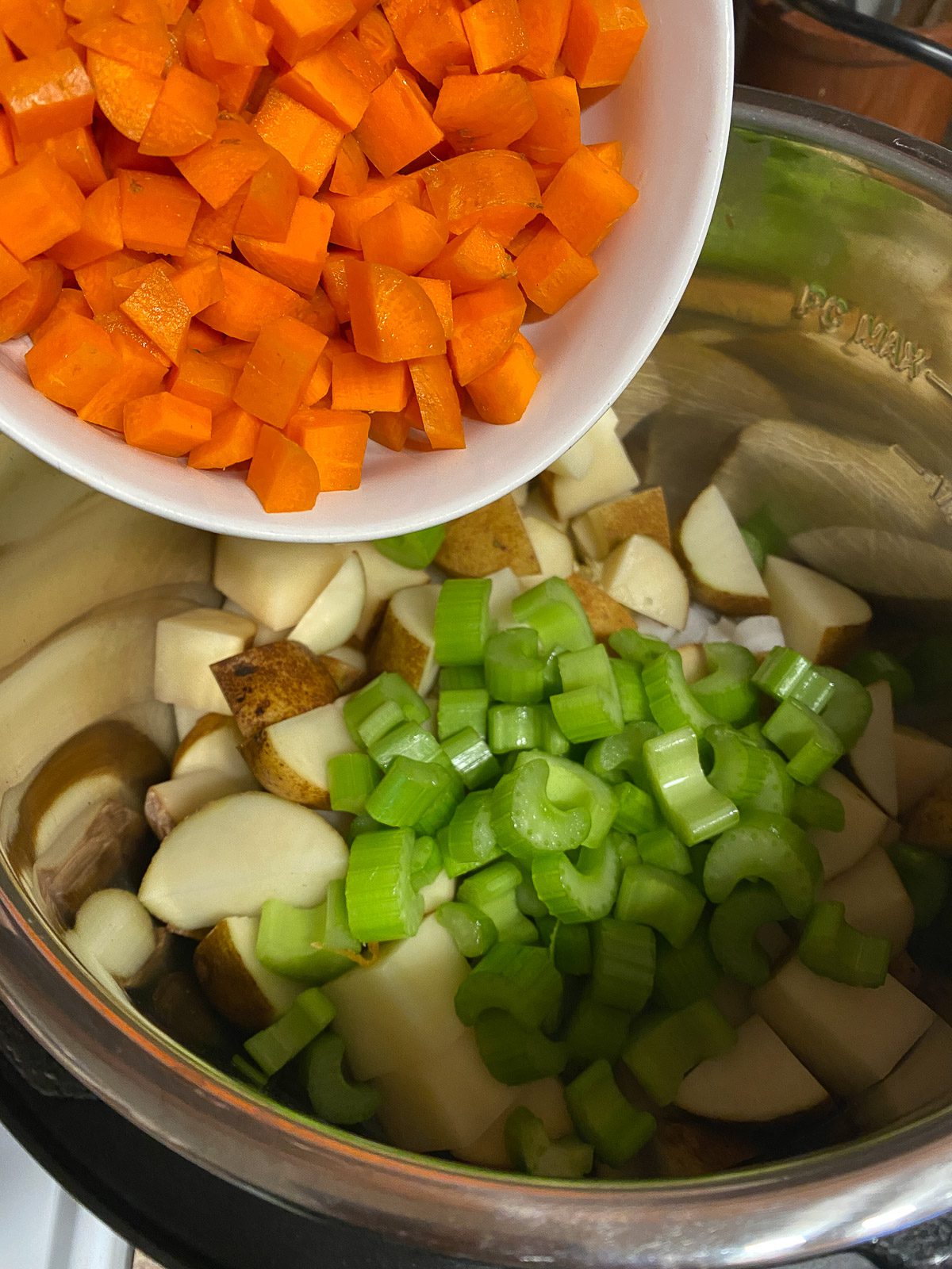 process shot of carrots being added to instant pot