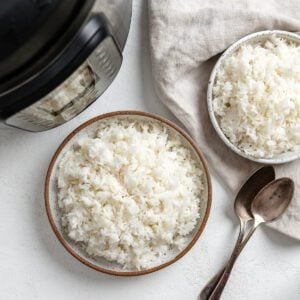 completed Perfect Instant Pot Jasmine Rice in two bowls against a white background
