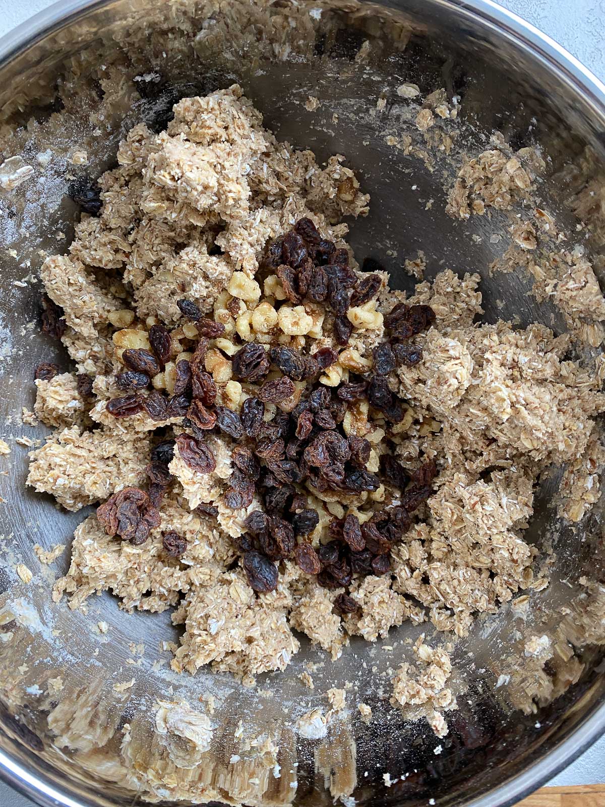 post shot of adding raisins to mixing bowl