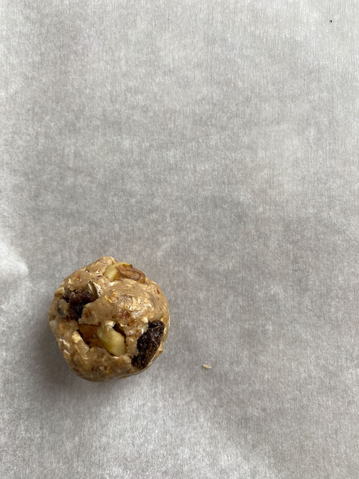 rolled dough ball on parchment paper