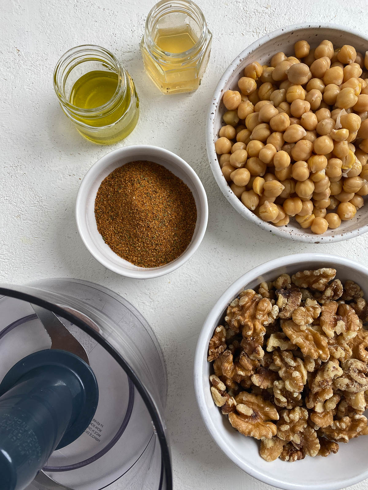 separate bowls of ingredients for chorizo tacos against a white background