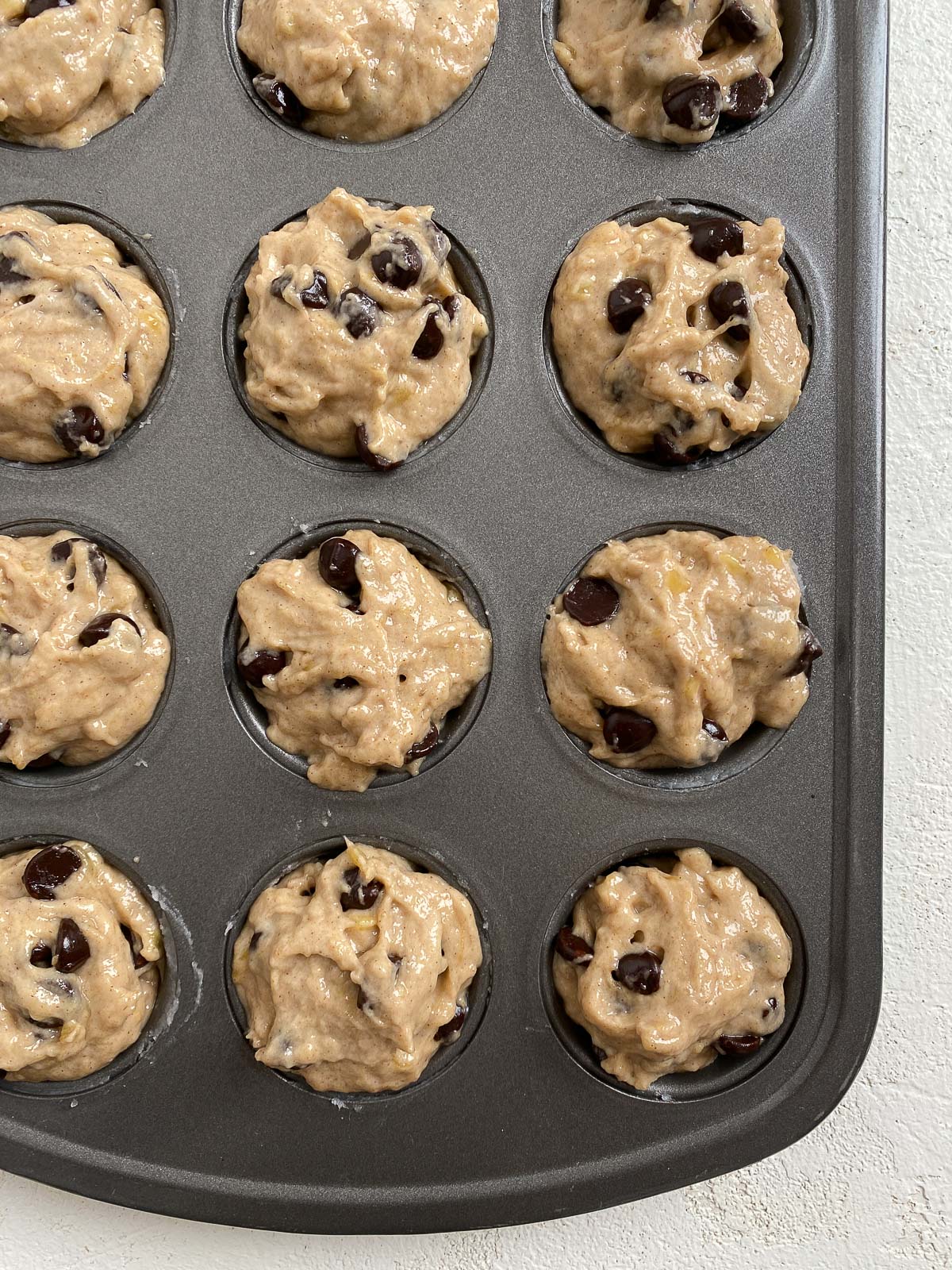 pre-cooked mini muffin dough in muffin tin