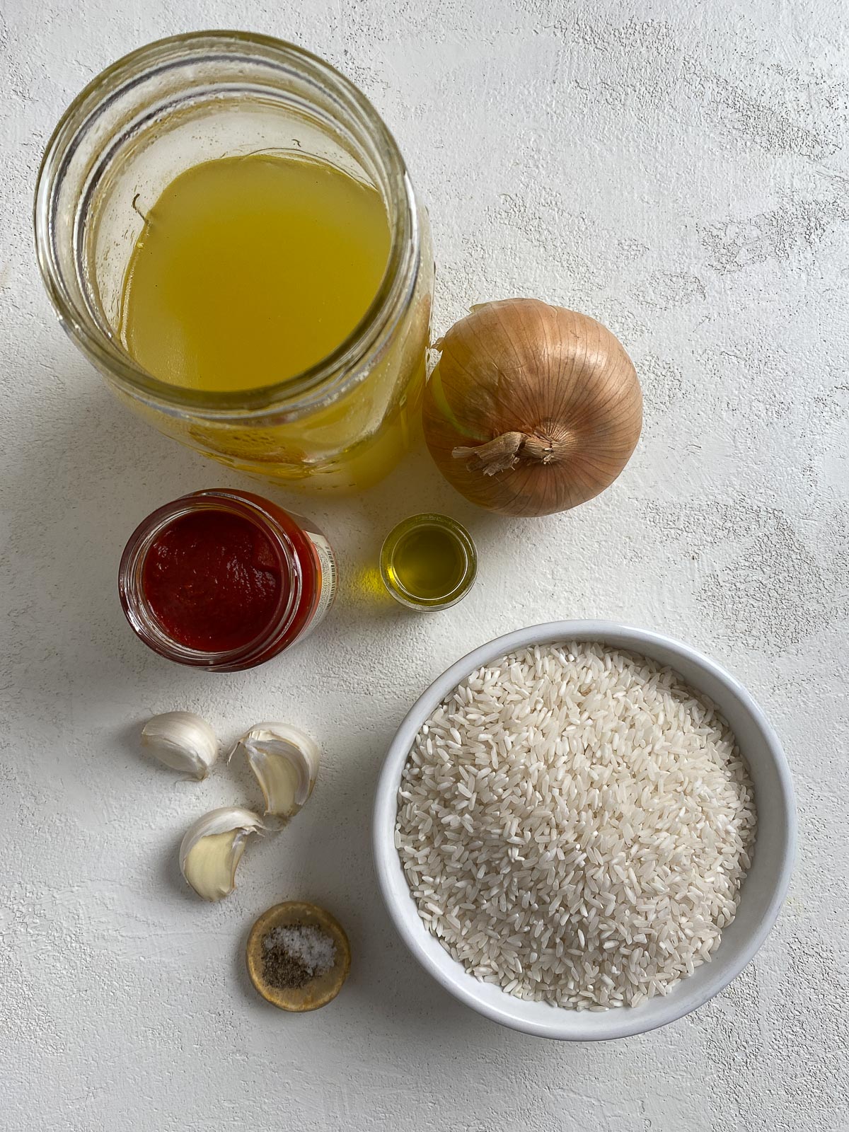 ingredients for mexican rice against a light background