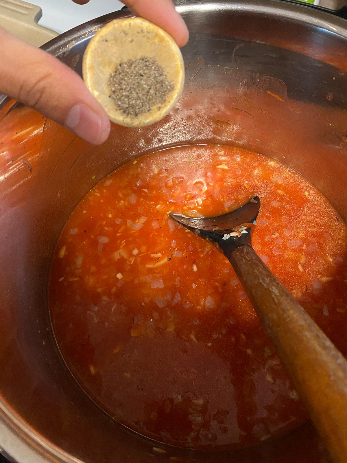process of adding spices to pot