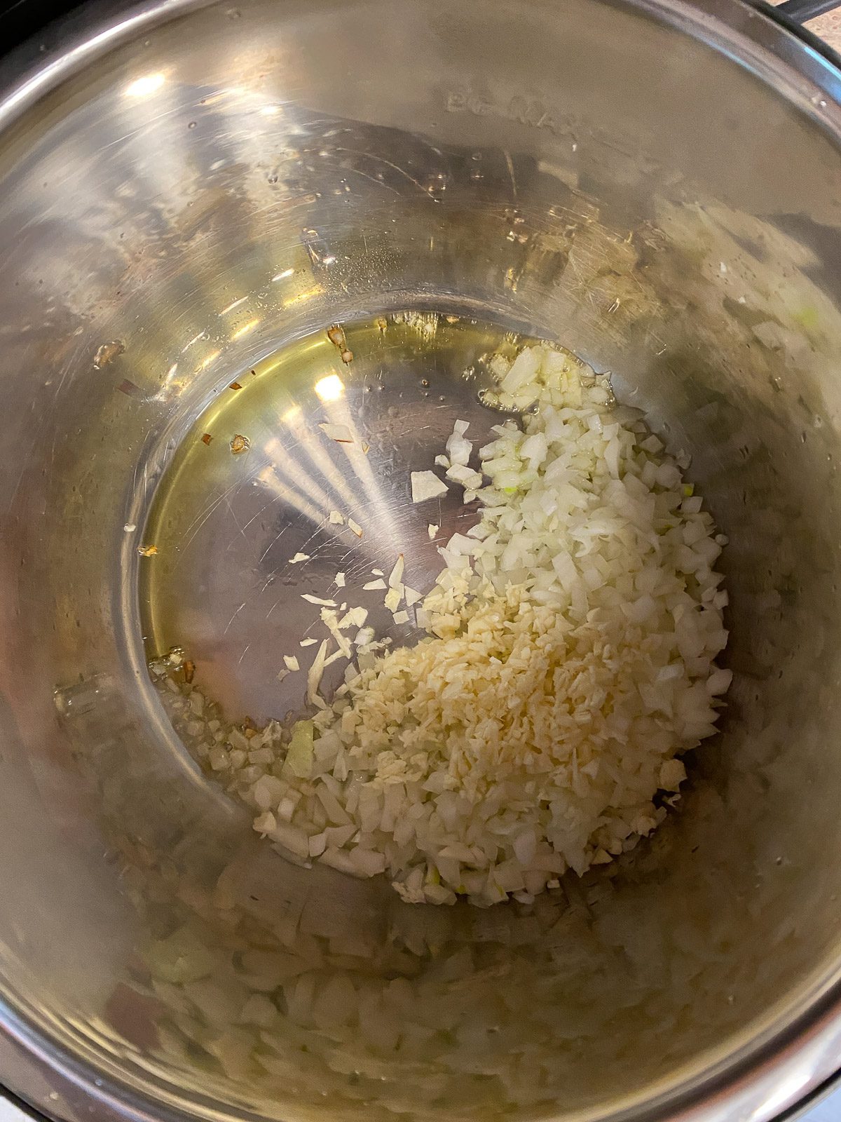 process of adding oil to pot