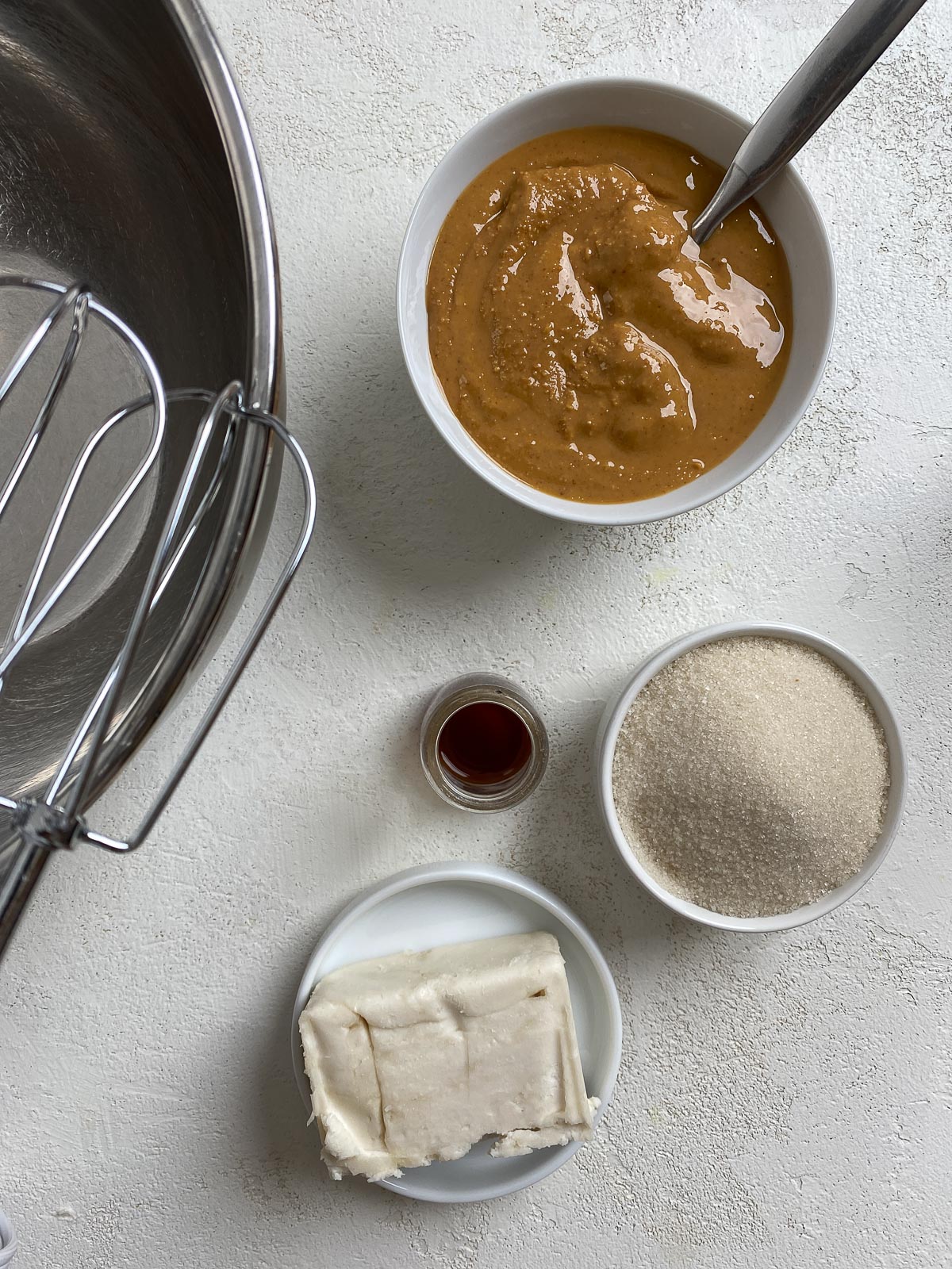 ingredients for Vegan Peanut Butter and Jelly Thumbprint Cookies measured out against a white surface