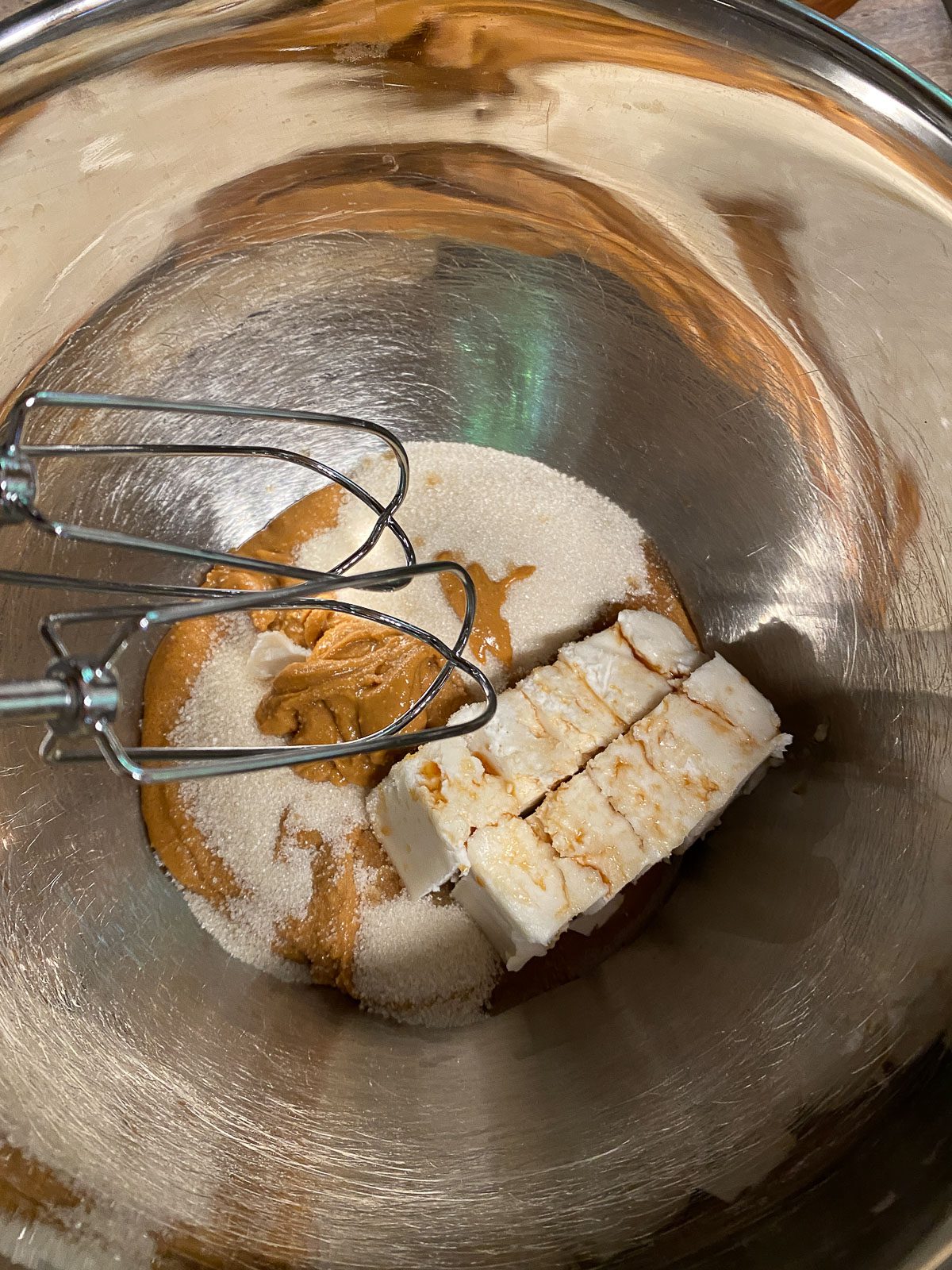 process of mixing ingredients for Vegan Peanut Butter and Jelly Thumbprint Cookies in bowl
