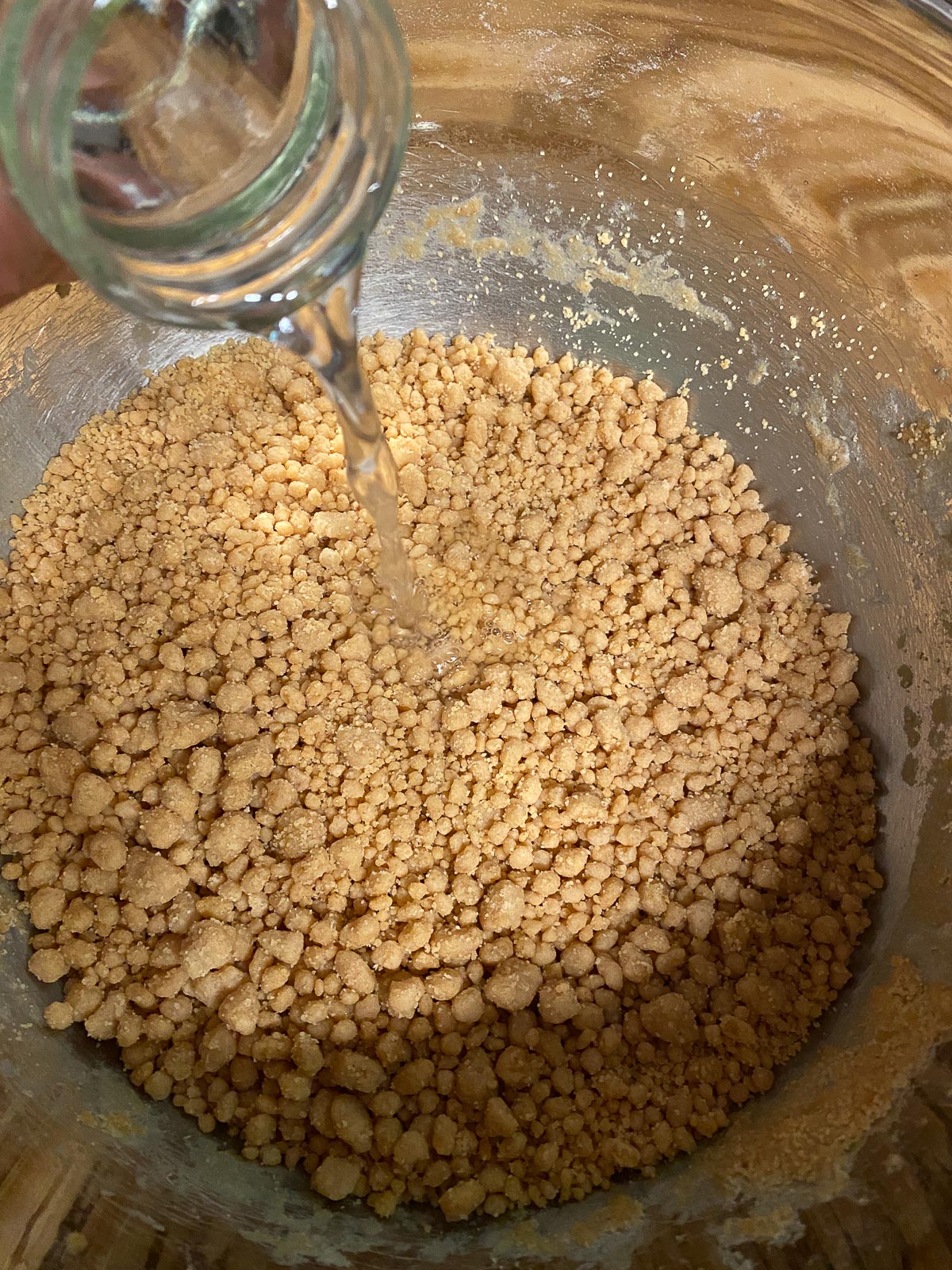 process of beating flour into mixture