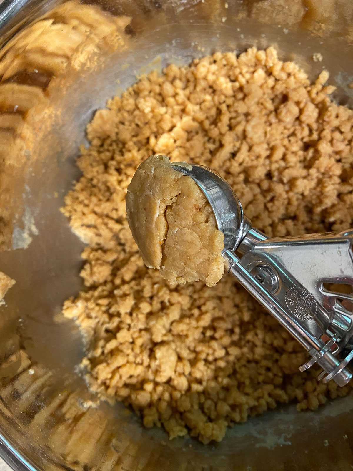 process of scooping out a tablespoon of dough from batter