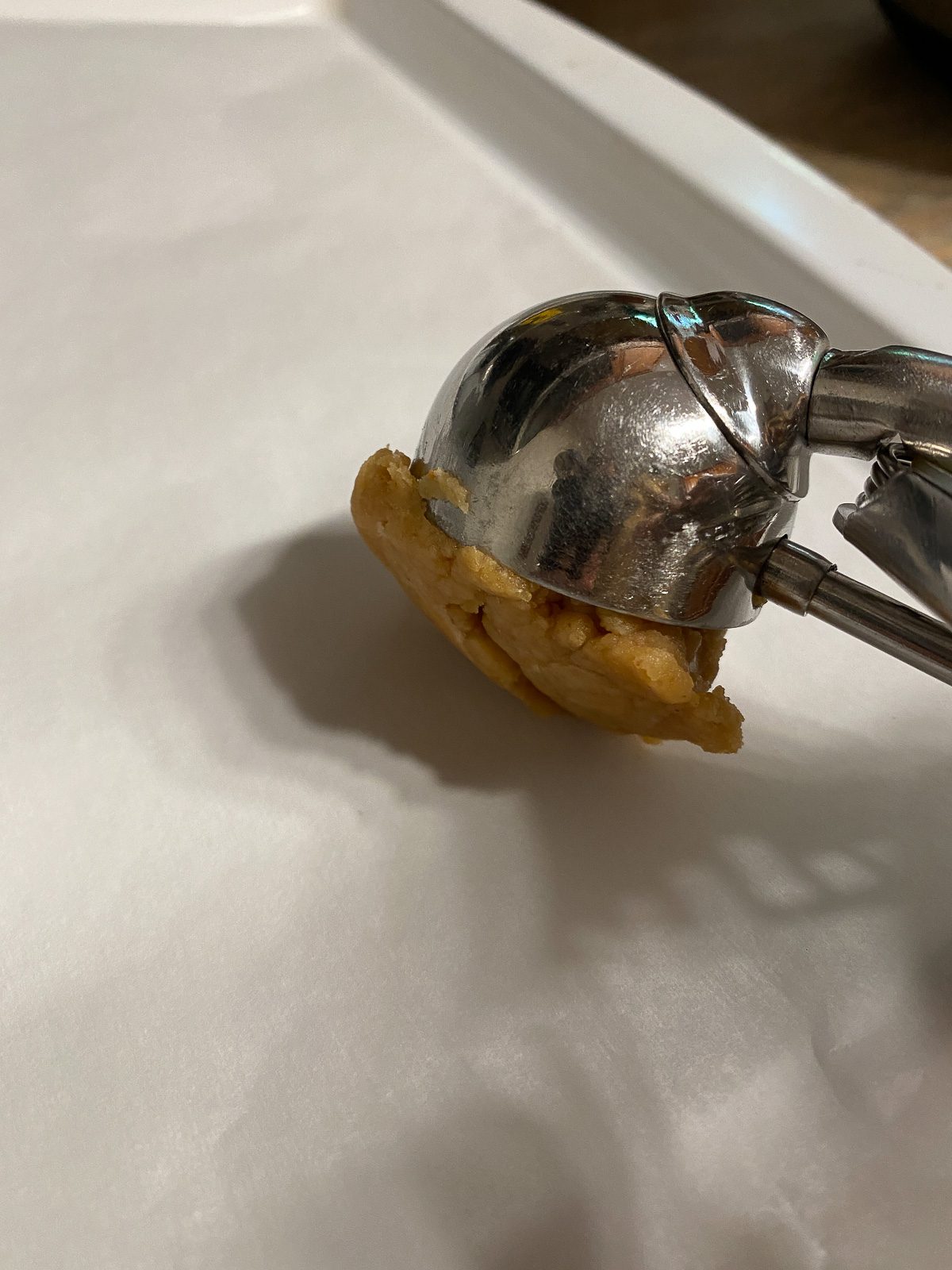 process of placing tablespoon of dough onto baking sheet