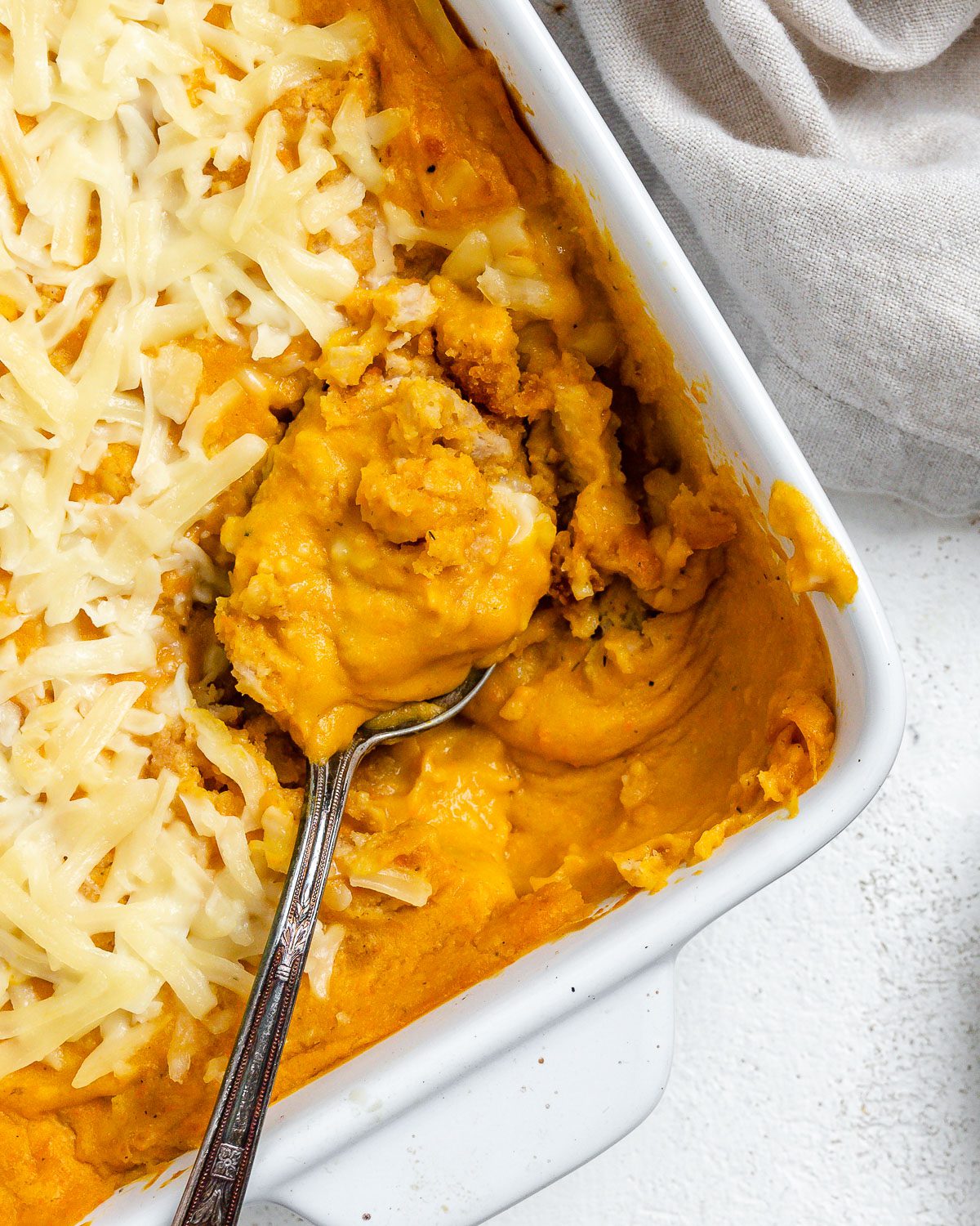 completed Vegan Buffalo Chicken Dip in a baking dish against a light background