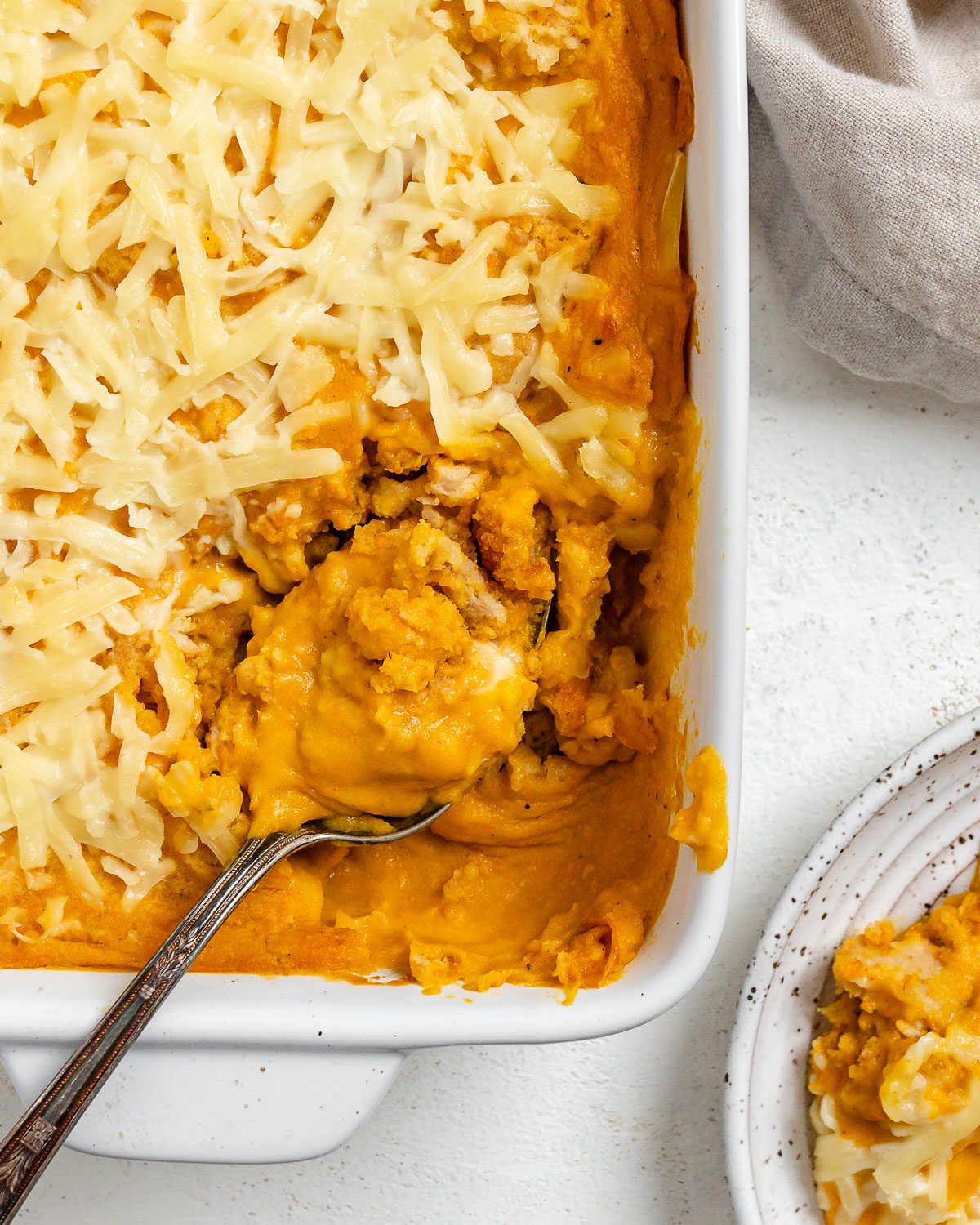 completed Vegan Buffalo Chicken Dip in a baking dish against a light background