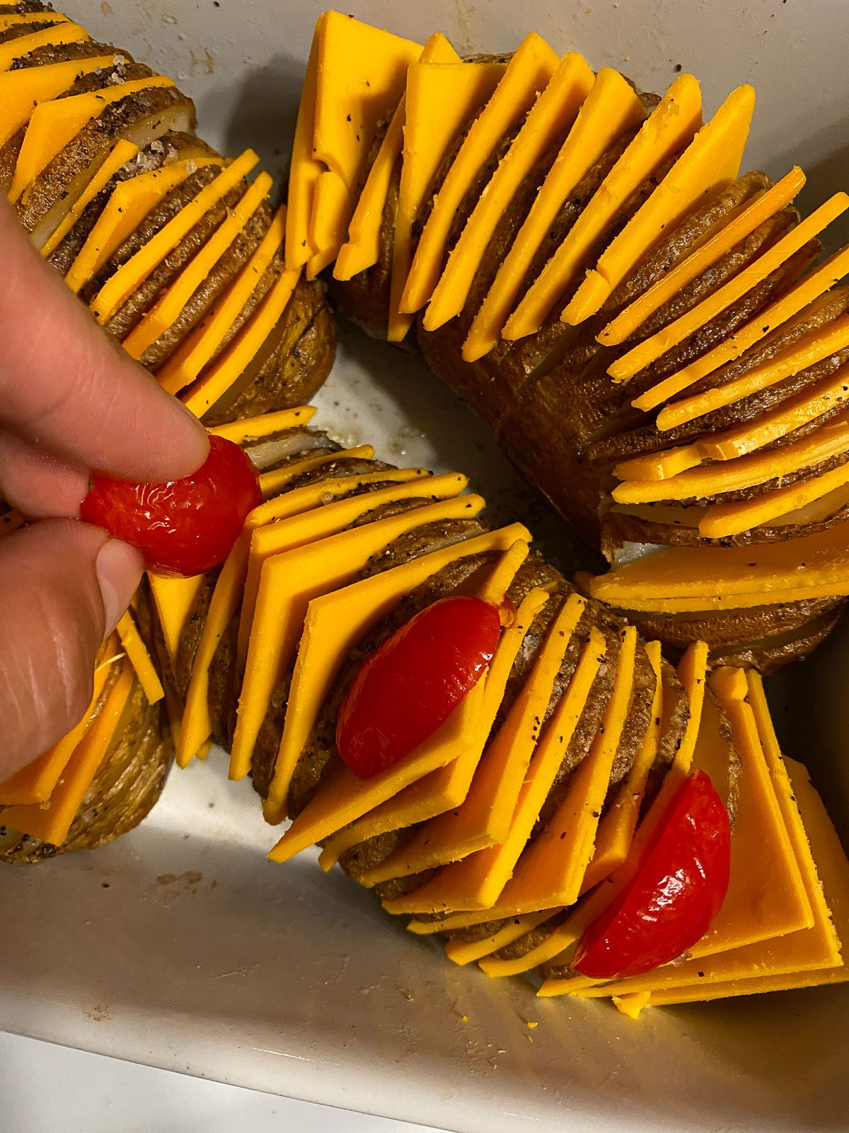 process of adding tomatoes to potatoes