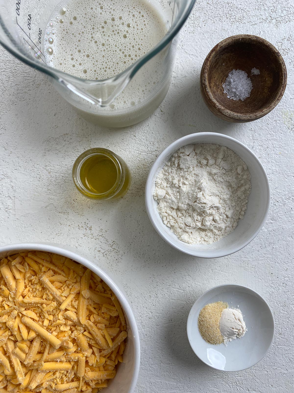 ingredients for Vegan Nacho Cheese measured out against a white surface