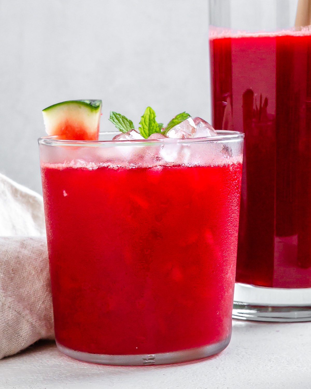 completed Fresh Watermelon Juice Blend in a glass cut with another cup in the background