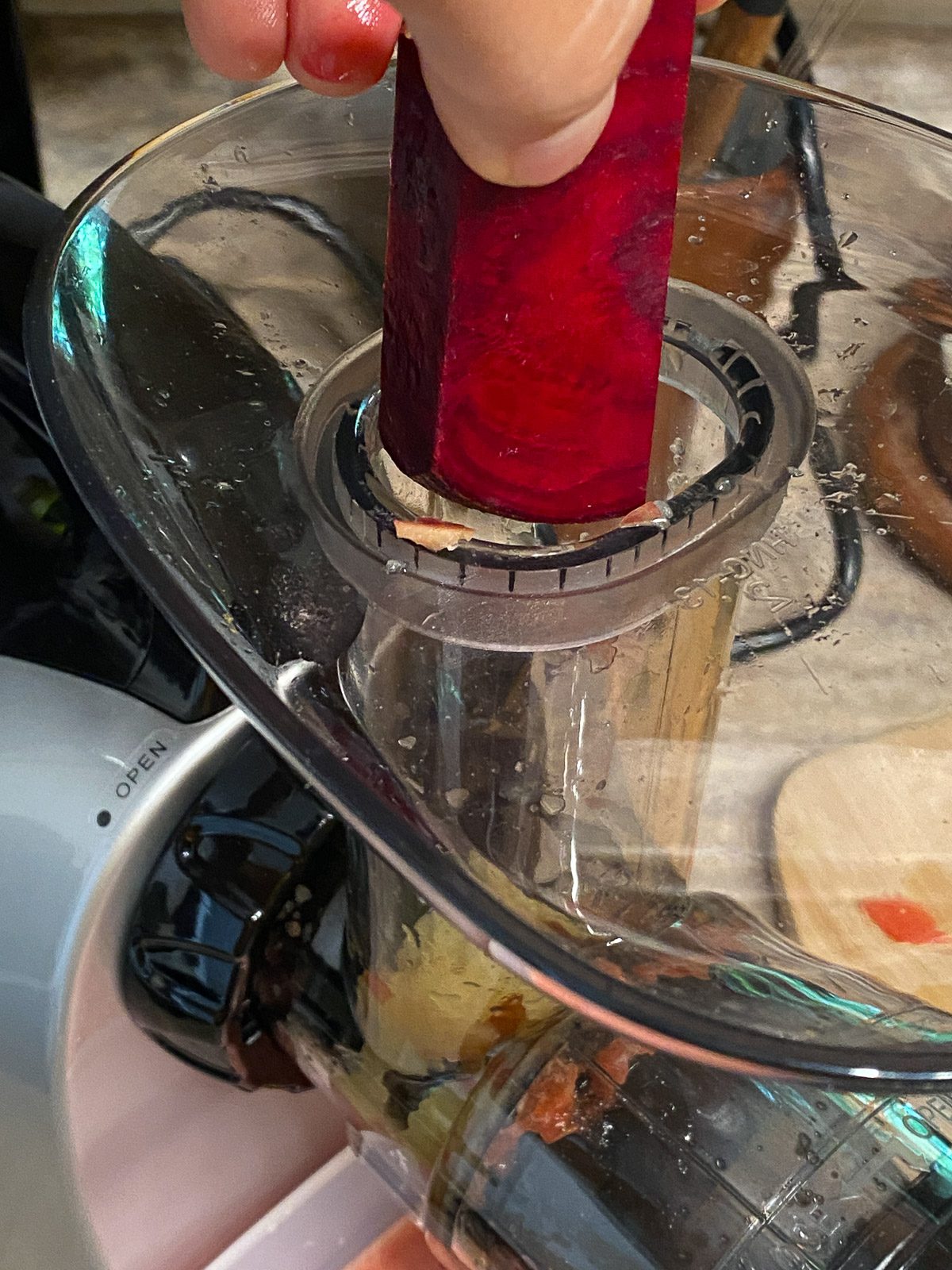 process shot adding beets to juicer