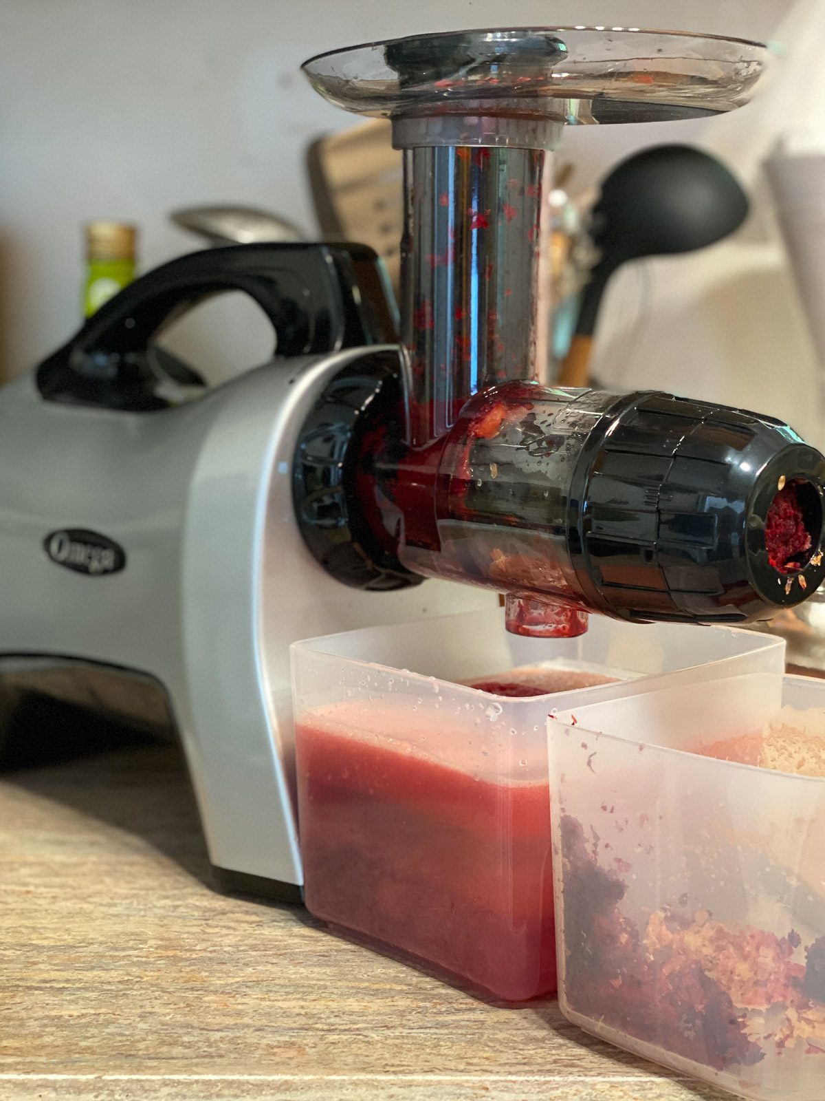 process shot showing juicer juice the ingredients for Fresh Watermelon Juice Blend