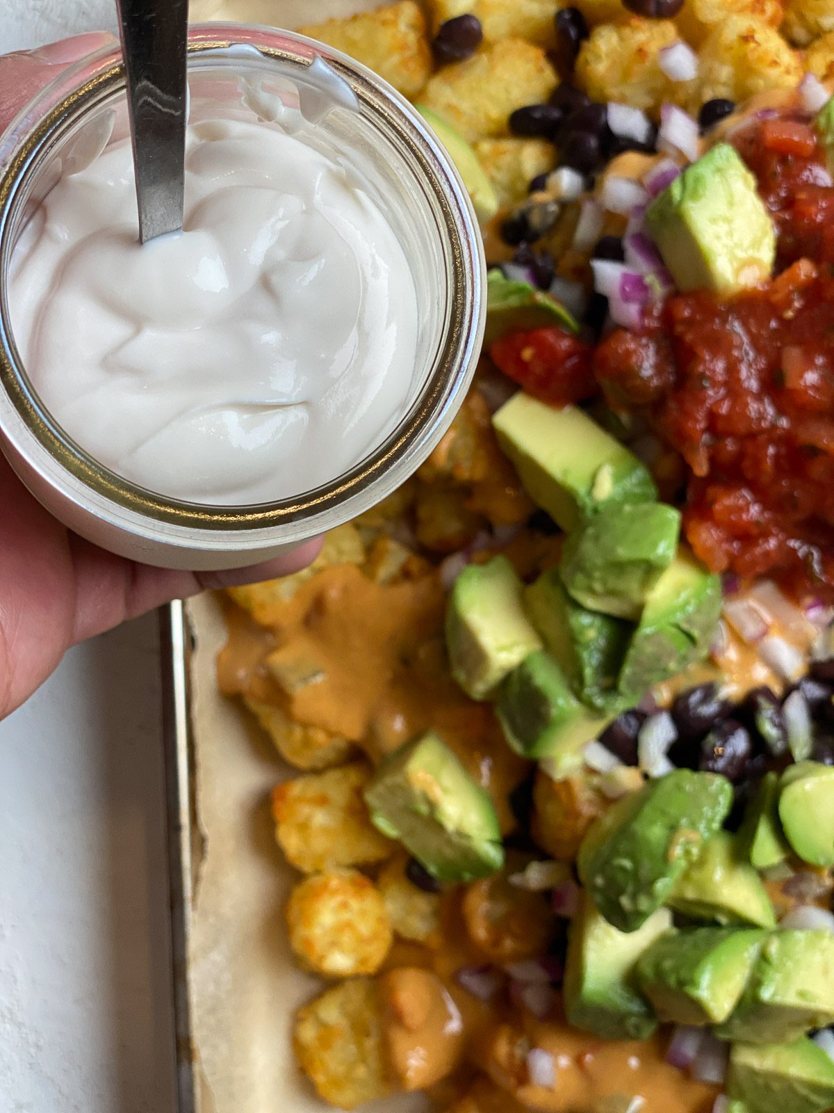 process of adding vegan cream to totchos