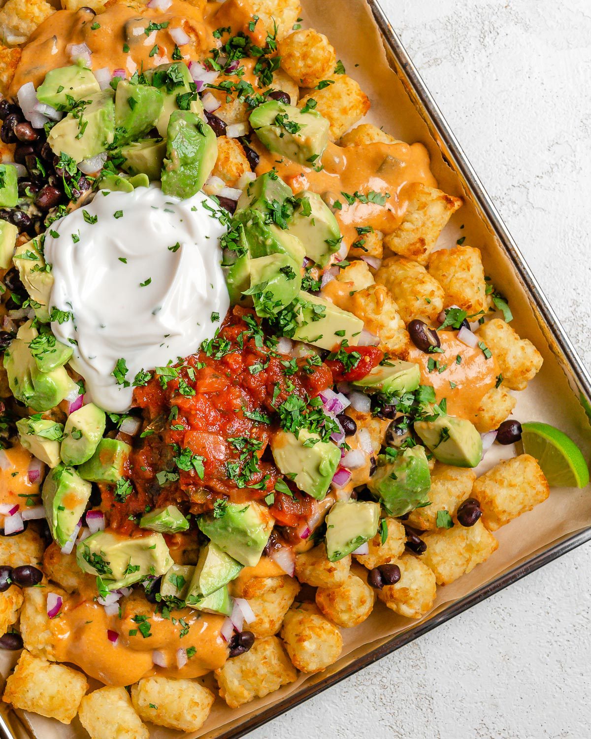 completed Totchos on a tray against a white surface