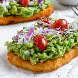 two completed pieces of Smashed Avocado Hashbrown Toast