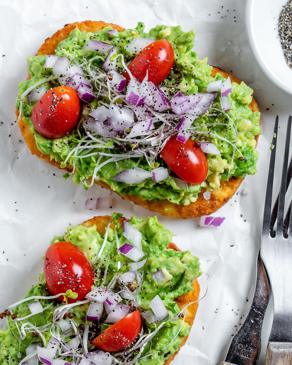 two completed pieces of Smashed Avocado Hashbrown Toast