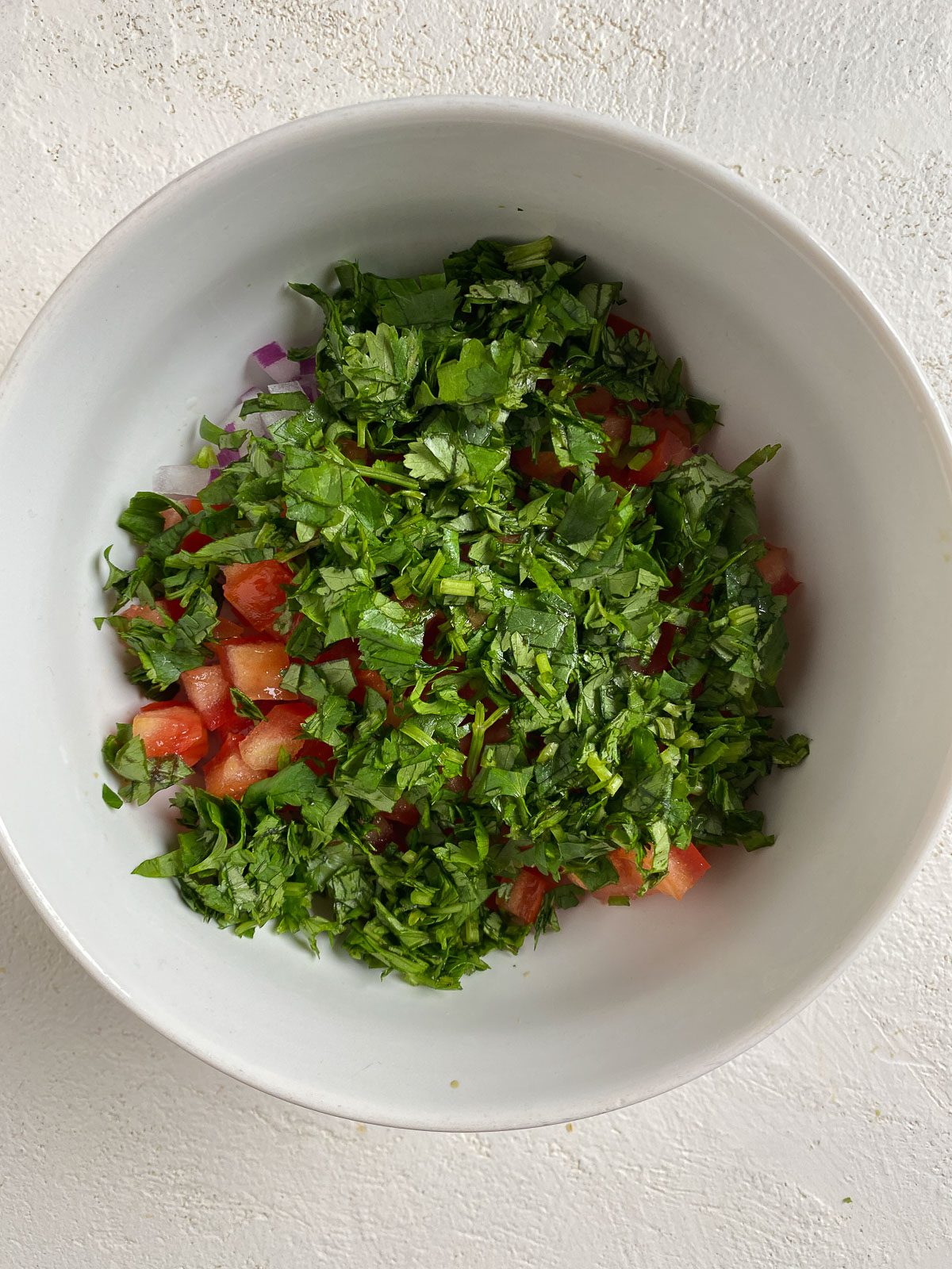 veggies for Vegan Bean Tostadas in a white bowl