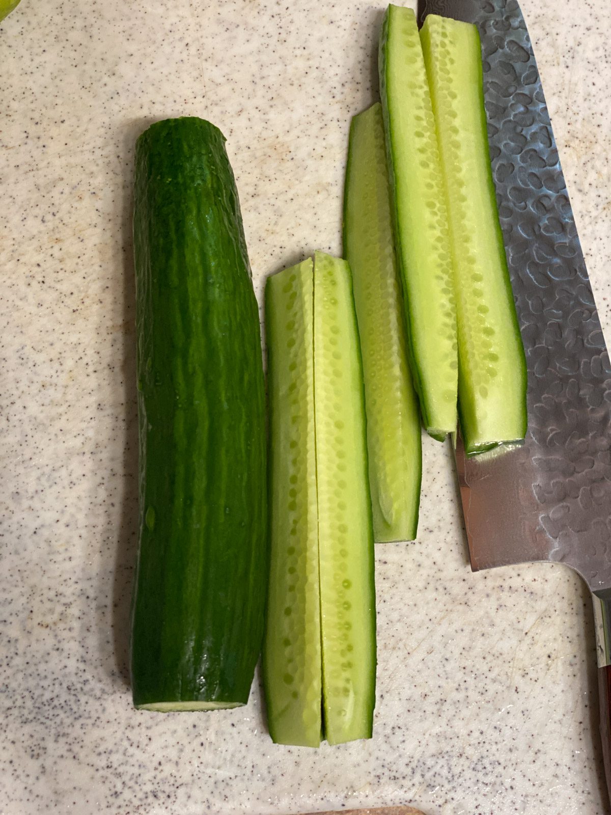 process showing the slicing of cucumbers
