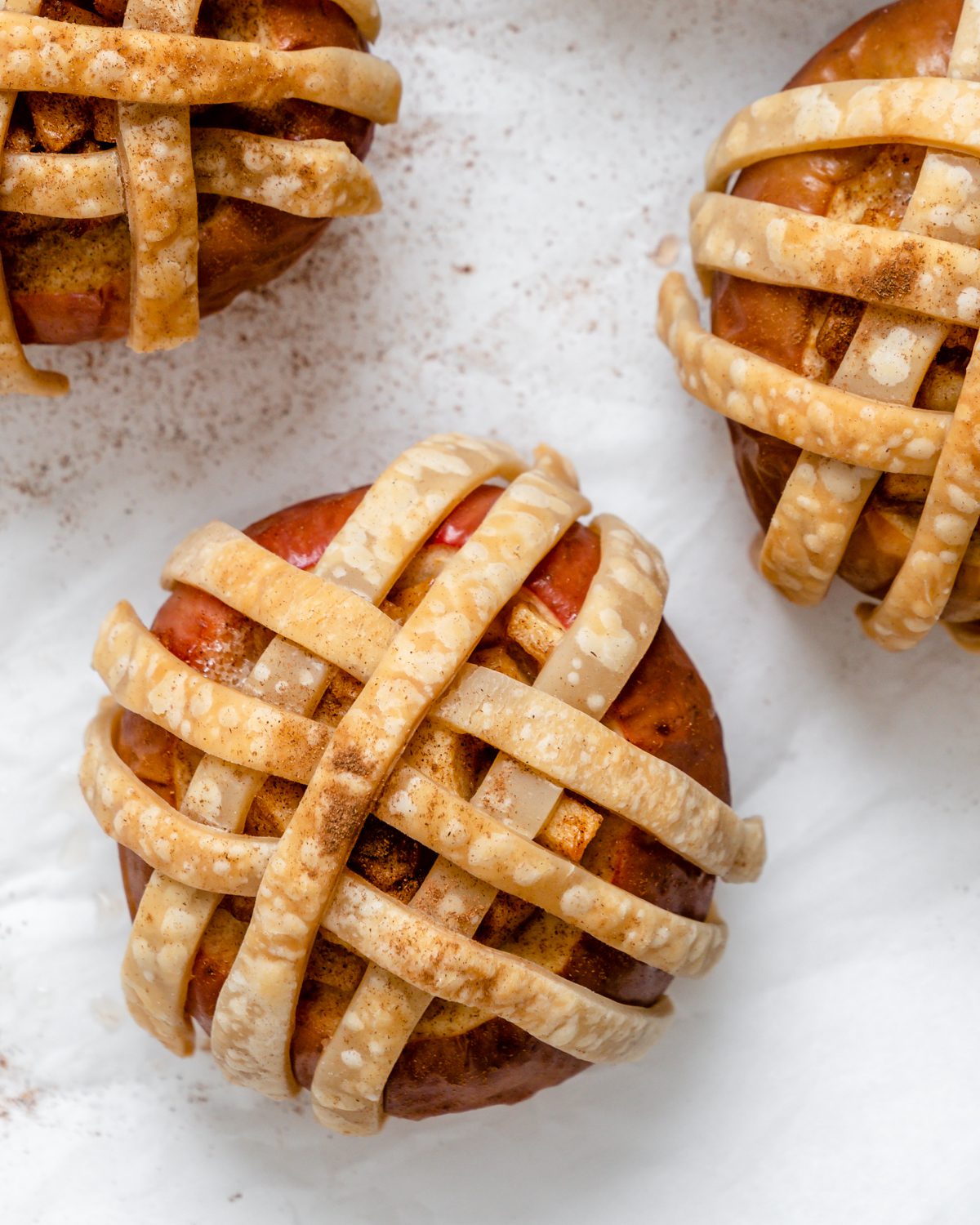 Completed Vegan Apple Pie Baked Apples on a white surface.