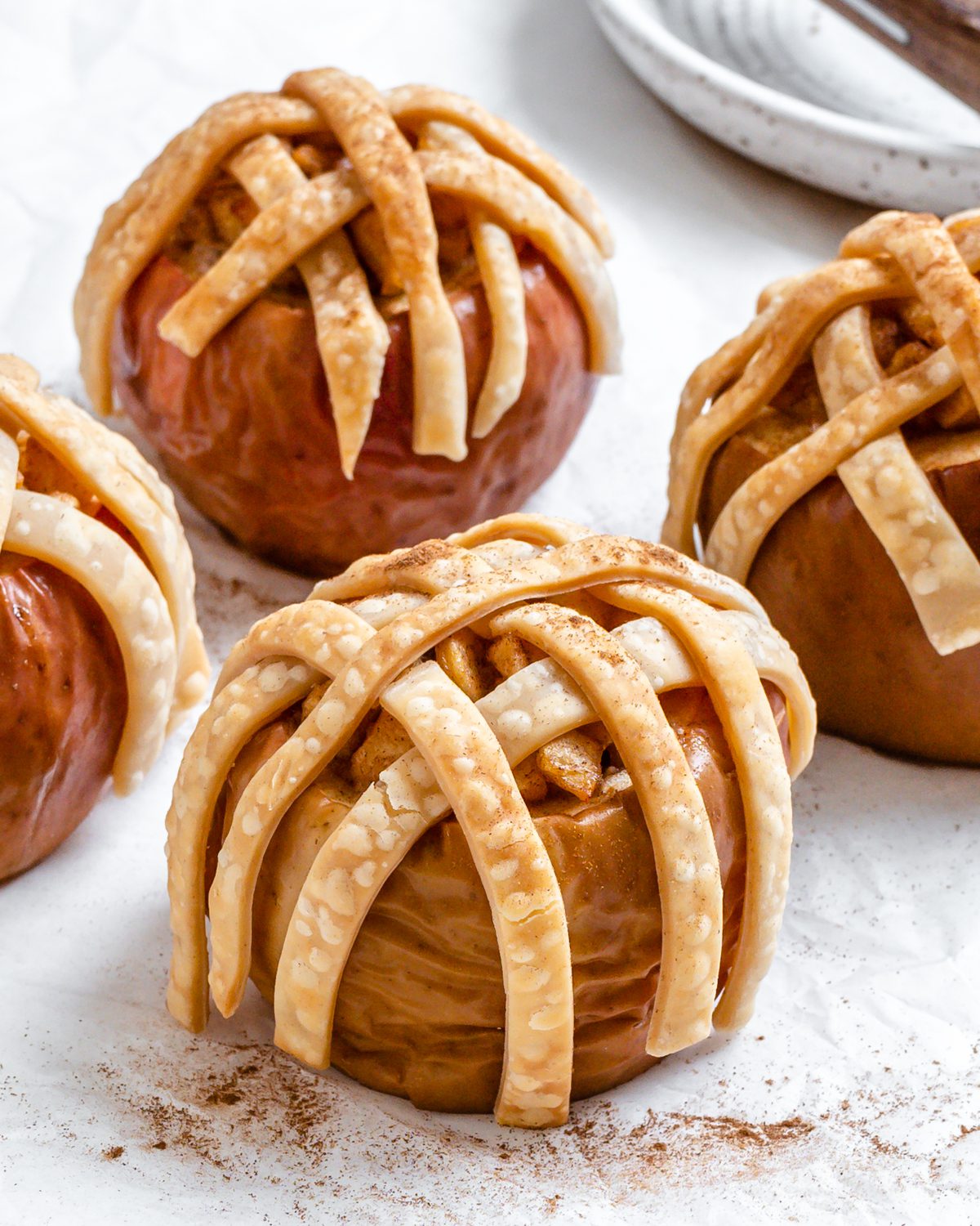 Completed Vegan Apple Pie Baked Apples on a white surface.