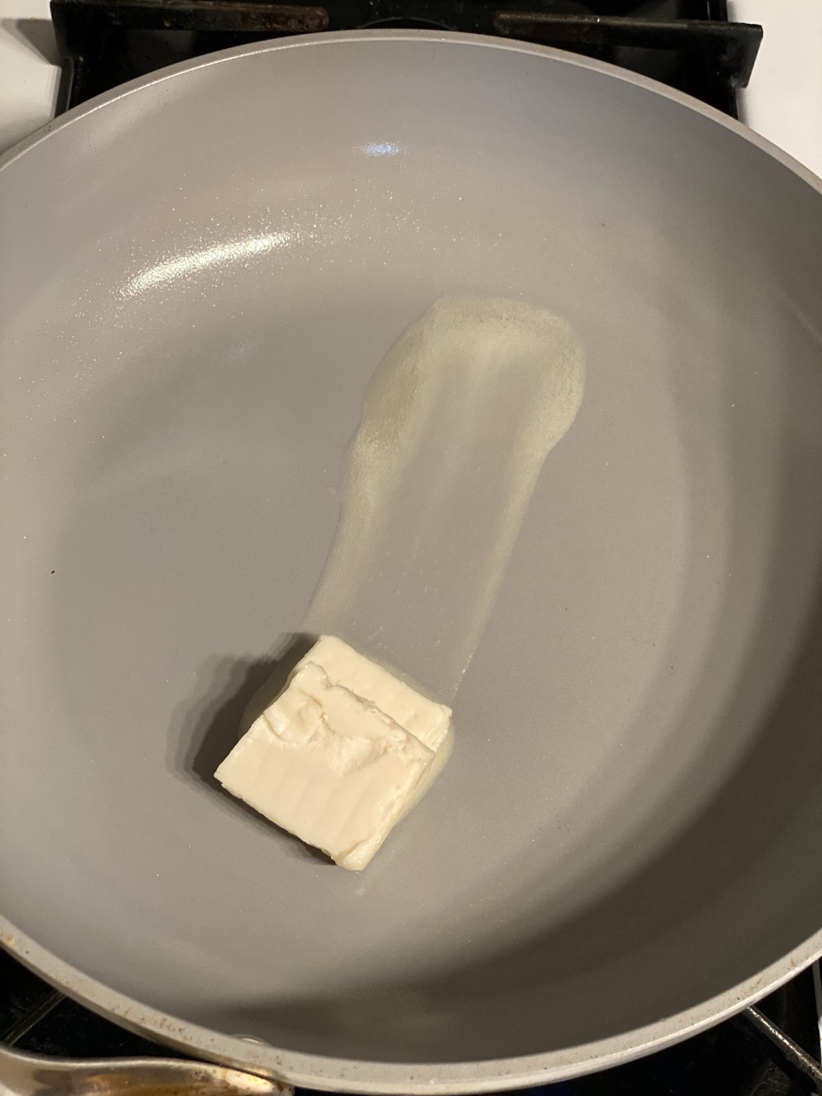 Process of butter melting in pan.