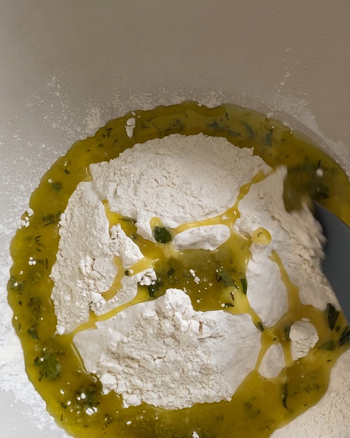 process of mixing yeast and herb mixture in bowl