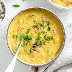 completed Vegan Corn Chowder in a bowl against a white background