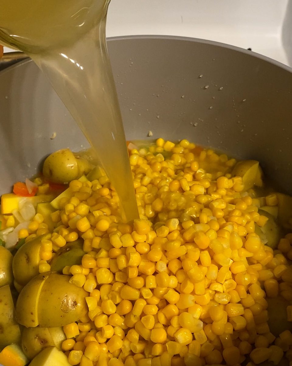 Process of adding veggie broth to pan.