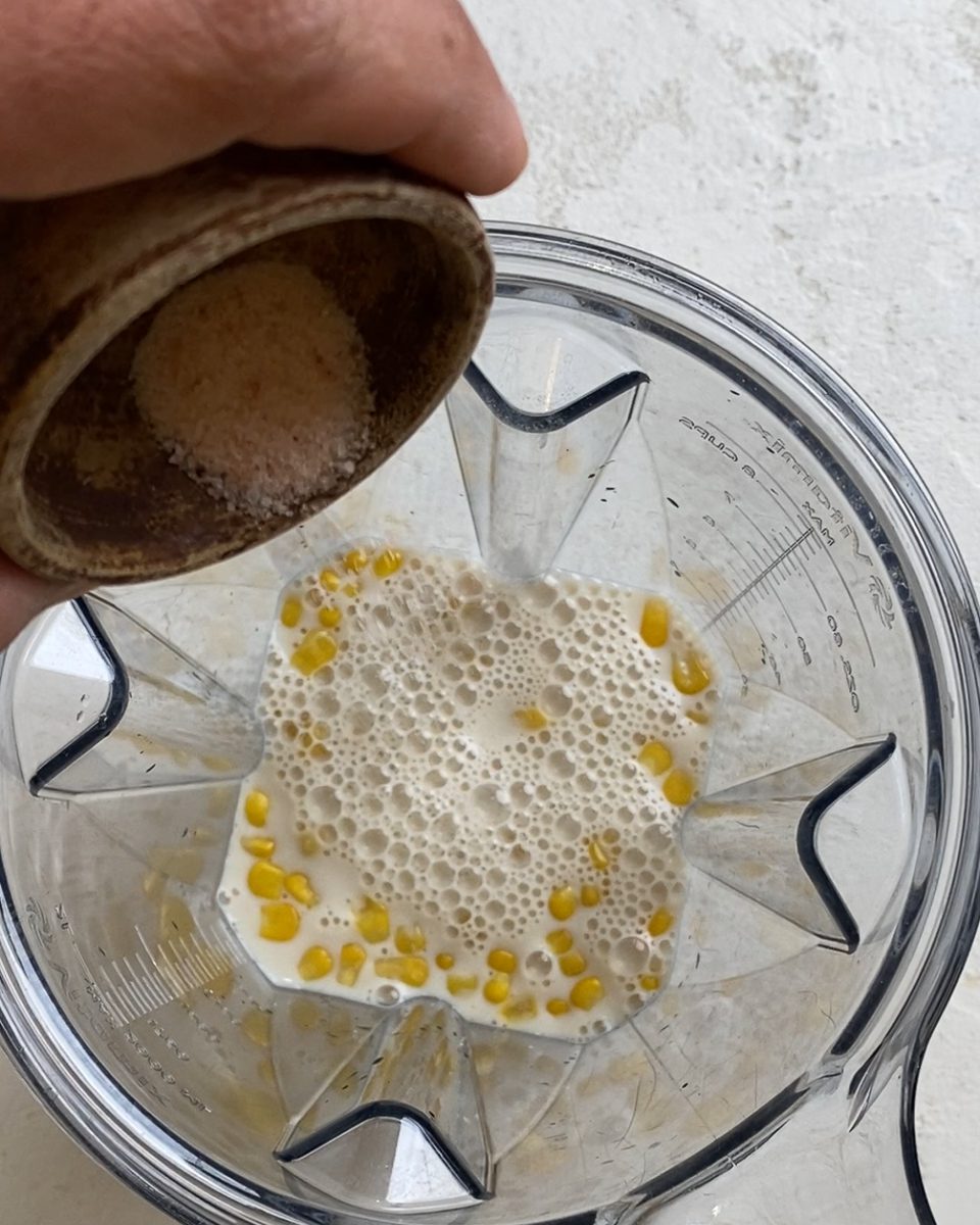 Process of adding salt to food processor.