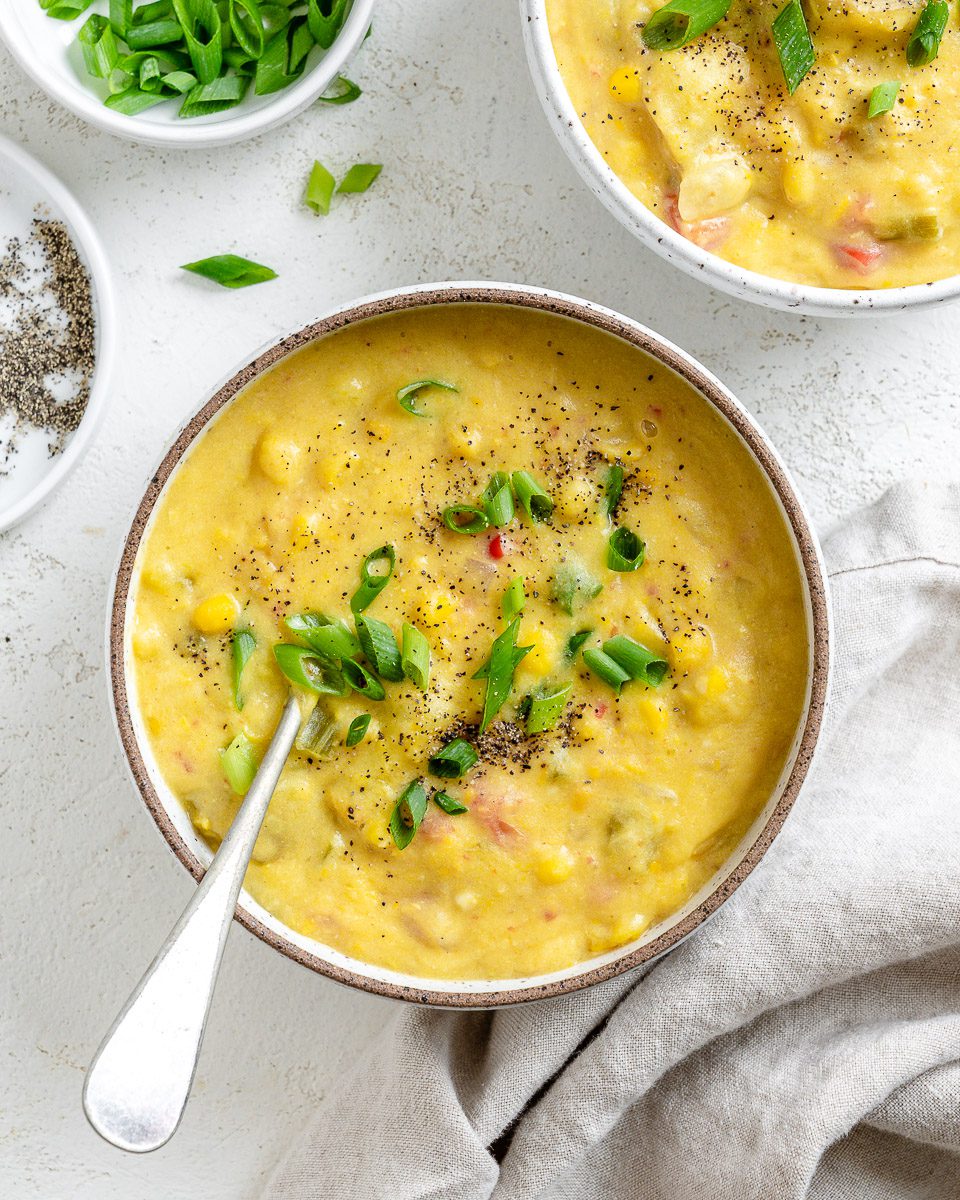 Completed Vegan Corn Chowder in a bowl against a white background.