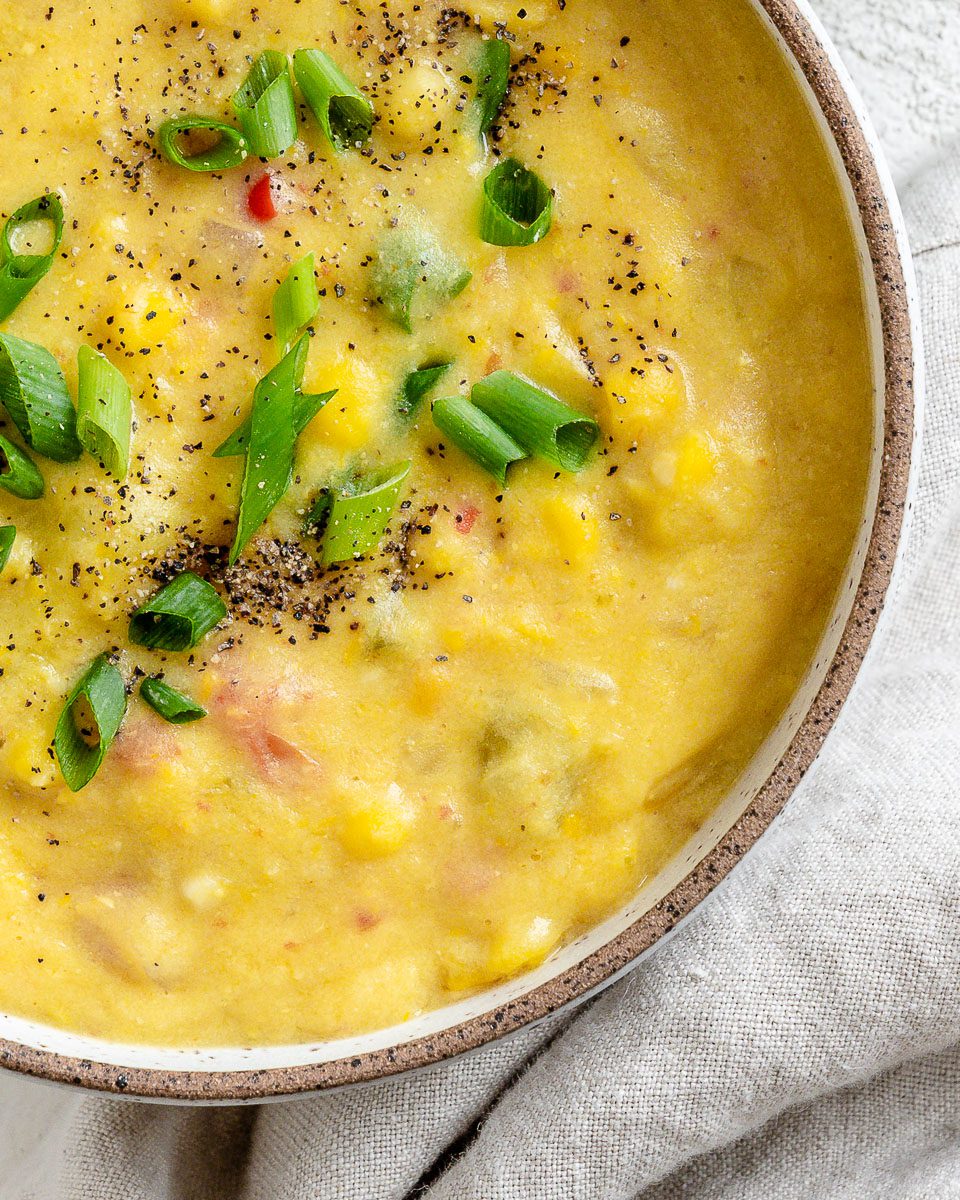 Completed Vegan Corn Chowder in a bowl against a white background.