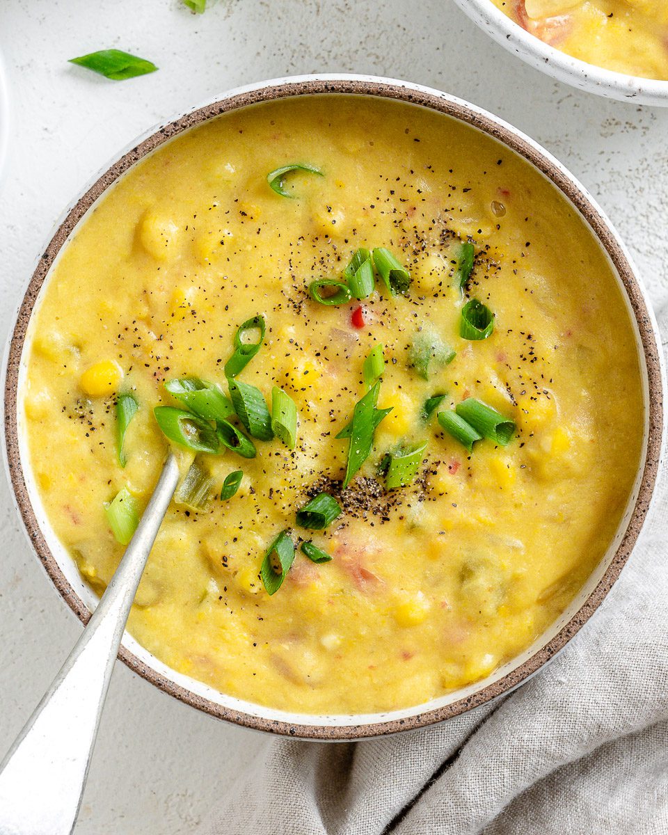 Completed Vegan Corn Chowder in a bowl against a white background.