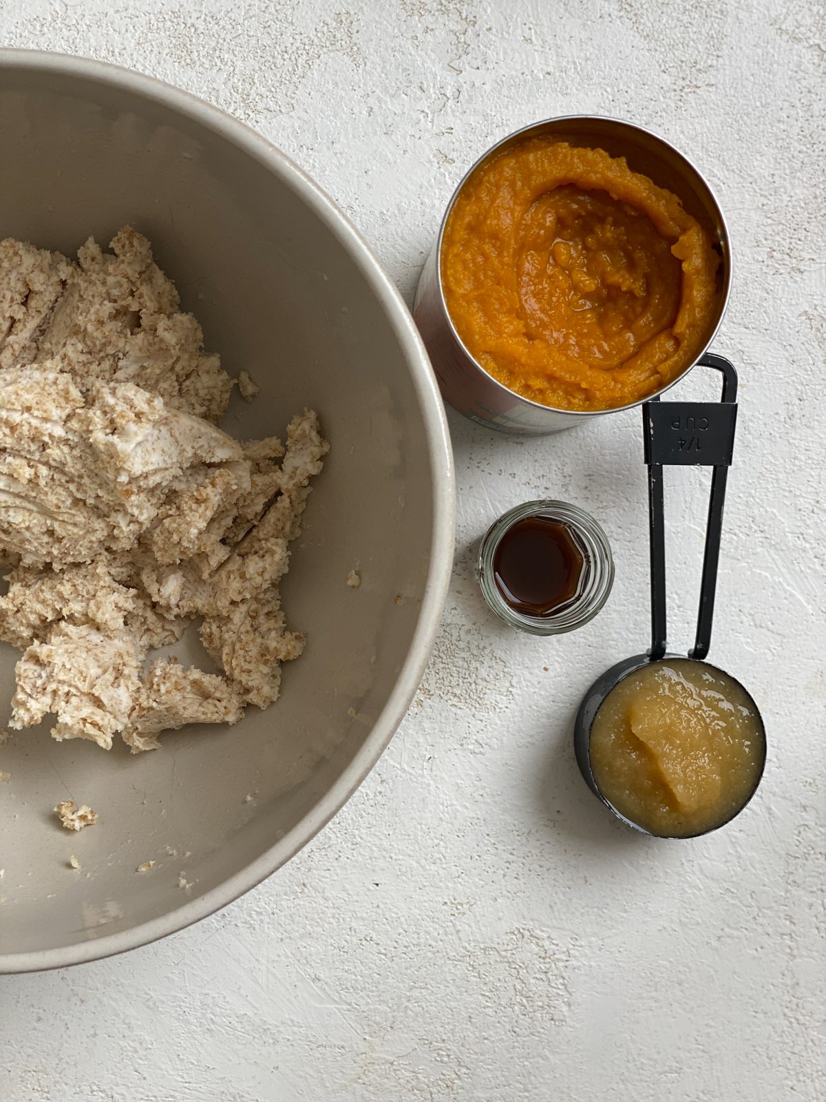 ingredients for Soft Gluten-Free Pumpkin Cookies alongside a bowl of mixed ingredients