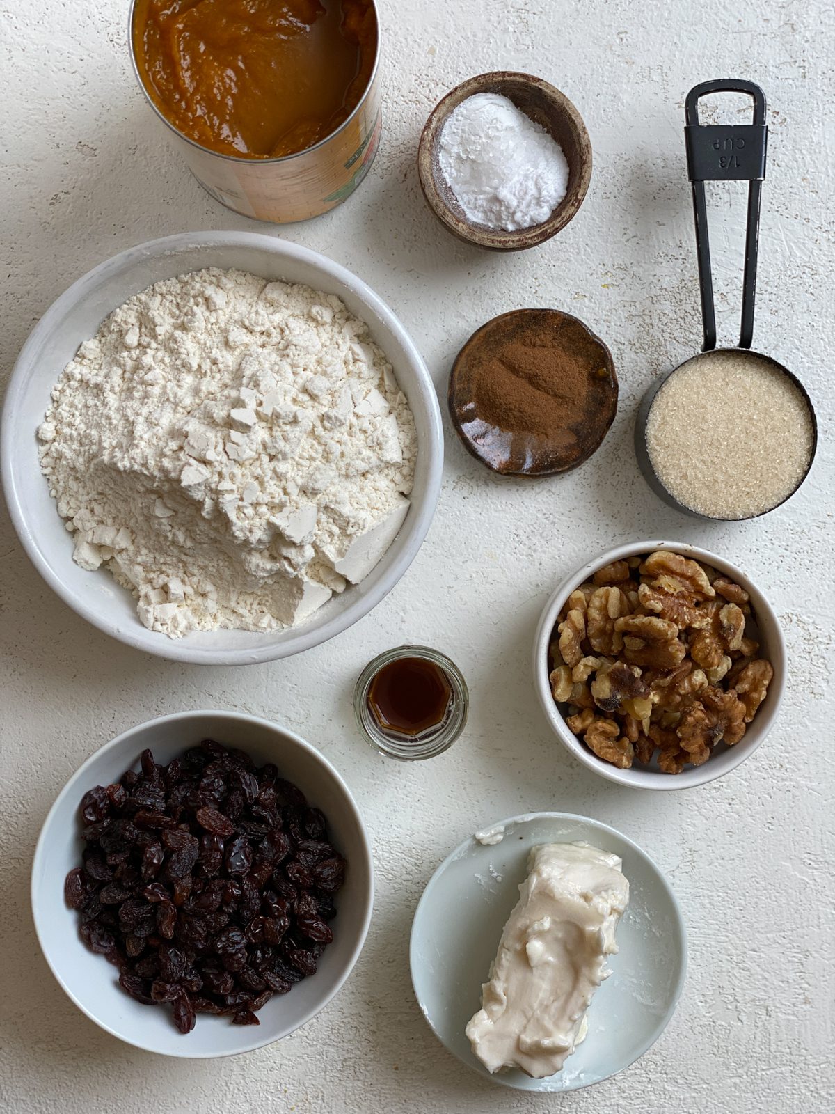 ingredients for Easy Vegan Pumpkin Muffins measured out against a white surface