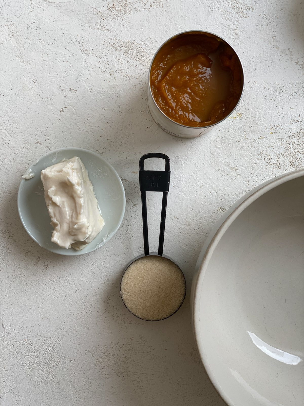 ingredients for Easy Vegan Pumpkin Muffins measured out against a white surface