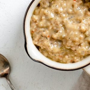 completed Vegan Sausage Gravy in a white bowl against a white surface