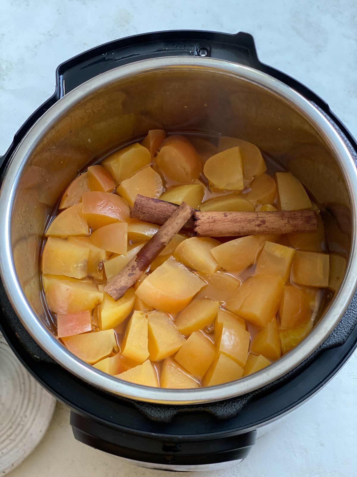 all ingredients for Vegan Instant Pot Apple Cider in an instant pot