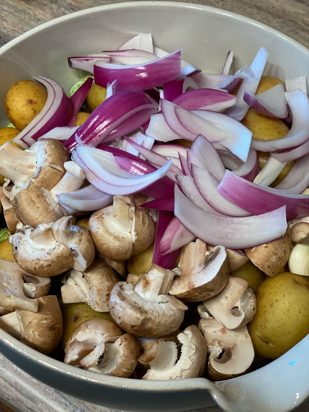 chopped and sliced veggies for Roasted Vegetables in a bowl