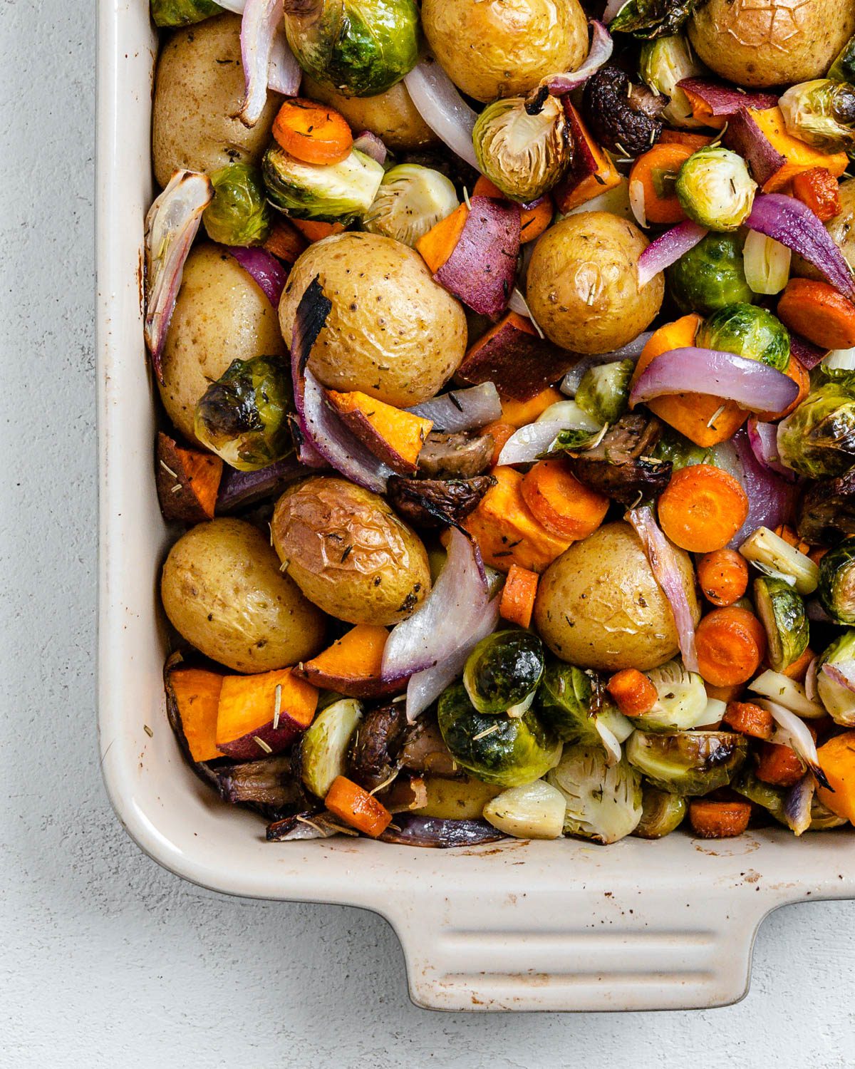 completed Roasted Vegetables in a baking dish against a light surface