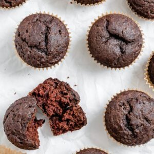 completed Vegan Chocolate Cupcakes scattered on a white surface