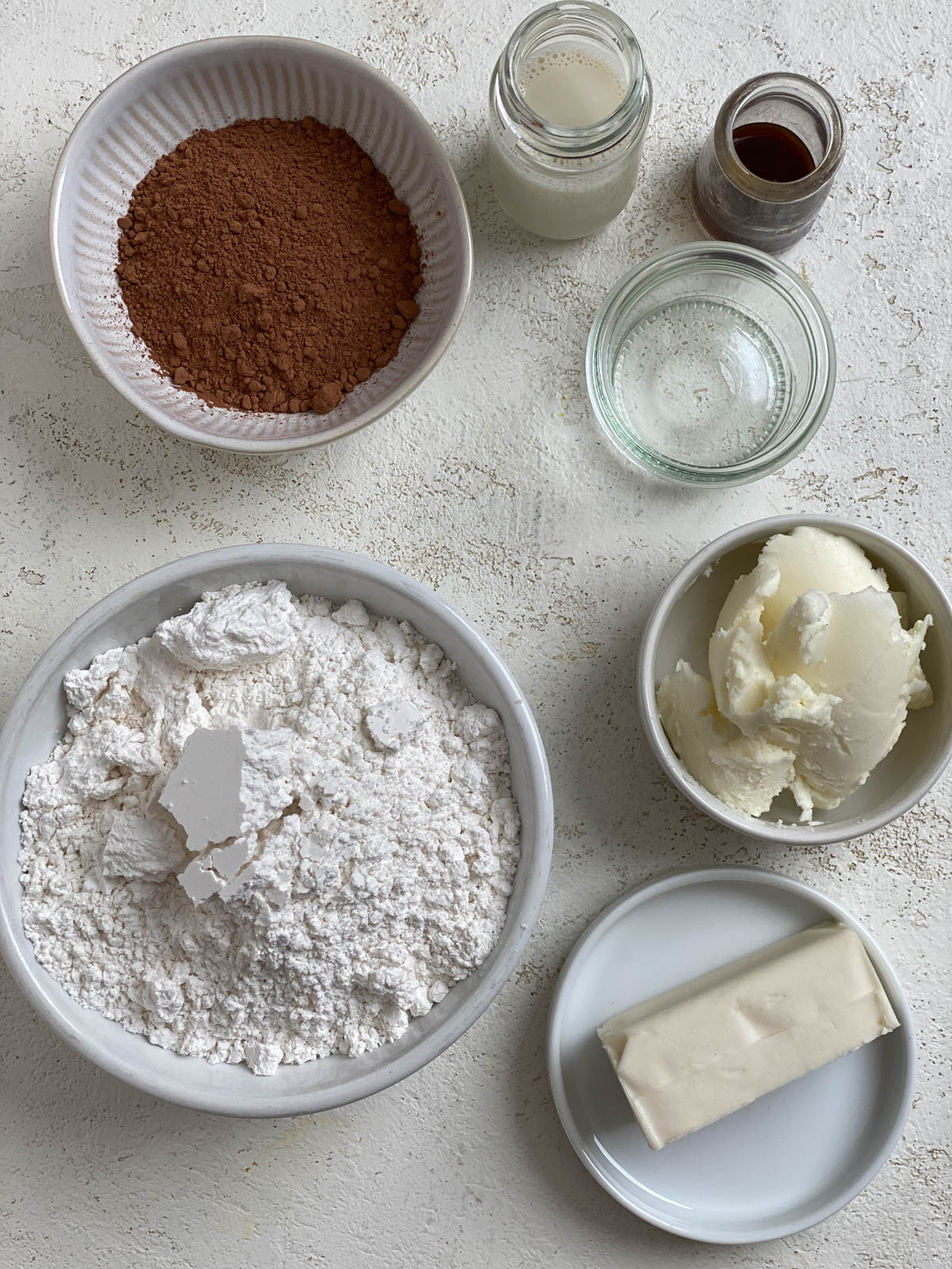 ingredients for Vegan Chocolate Frosting measured out against a white surface